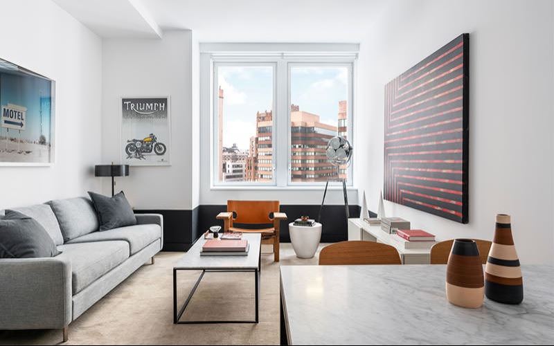 large windows brighten living room with city views