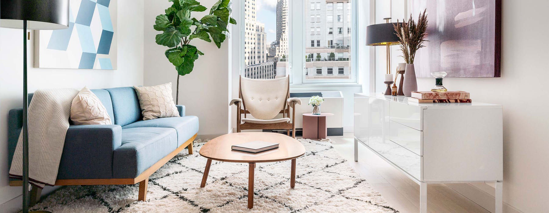 sun filled living room with city views