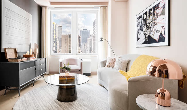 large windows brighten living room with city views